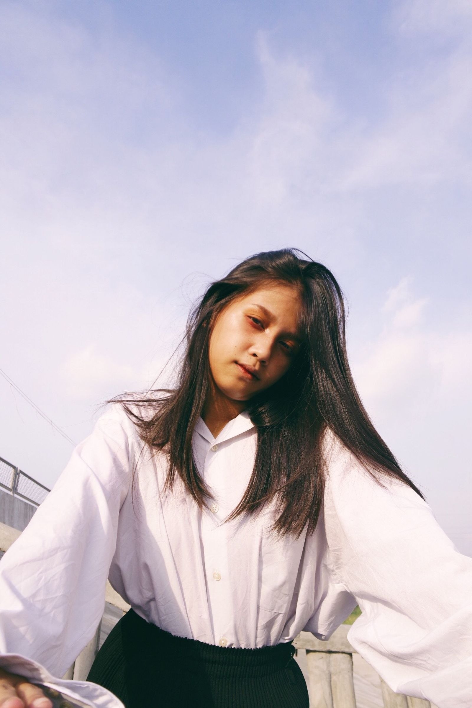 Woman wearing a white blouse outdoors