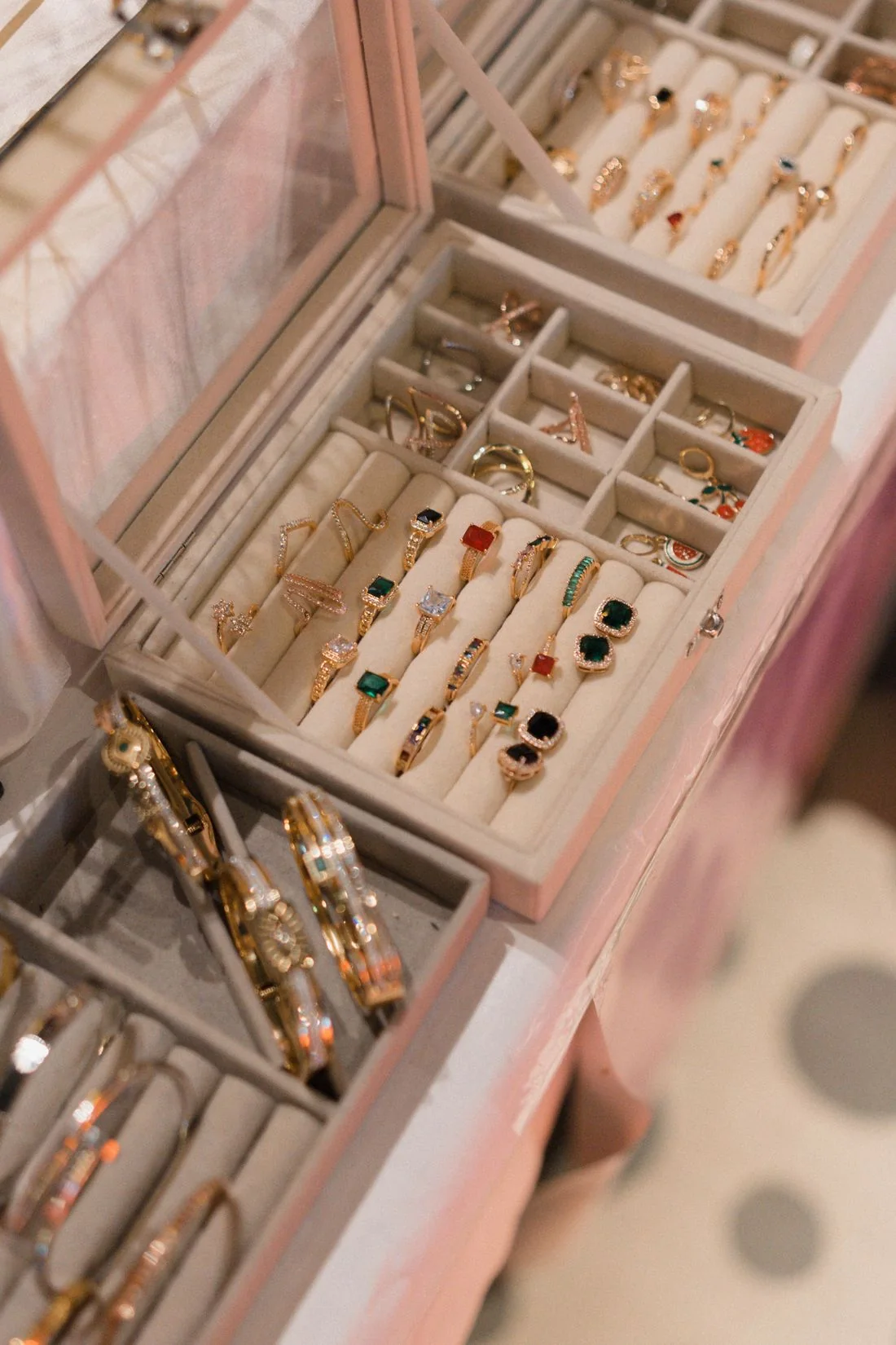 Rings and bangles arranged inside an open jewelry box