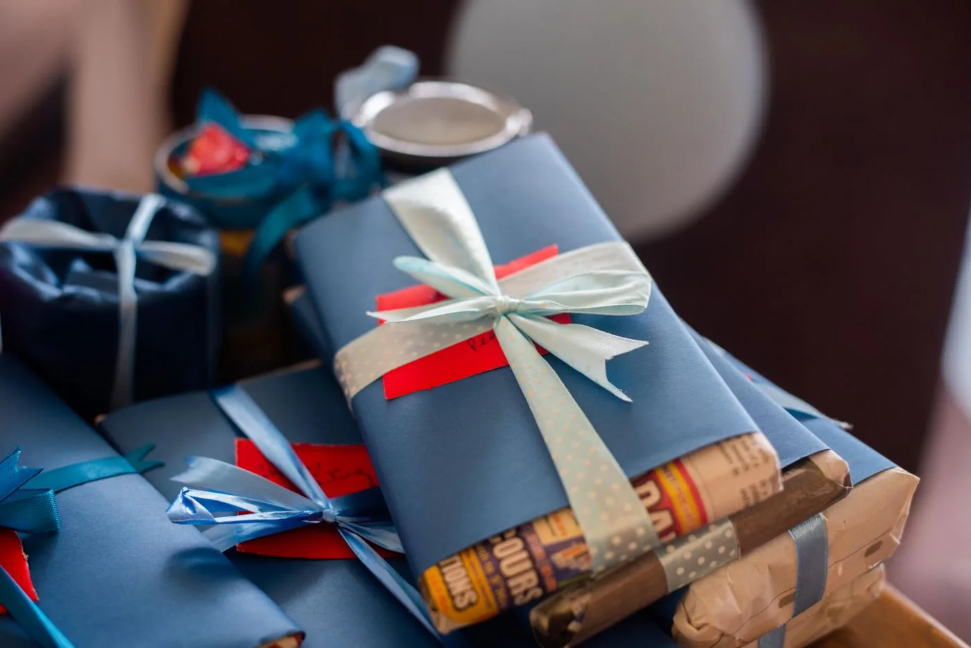 Wrapped gifts tied with blue and pale ribbons.