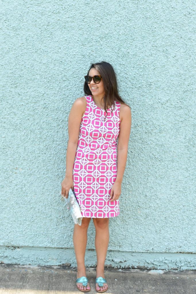 Turquoise wall & hot pink dress