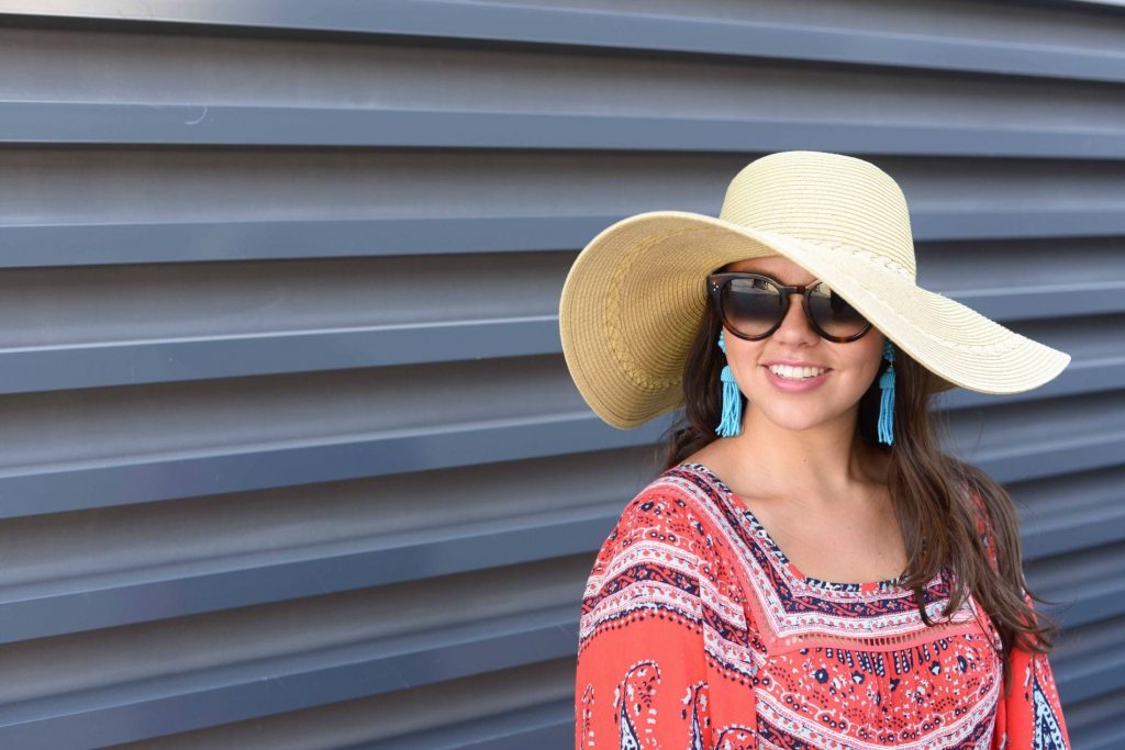 Floppy hat and statement tassel earrings