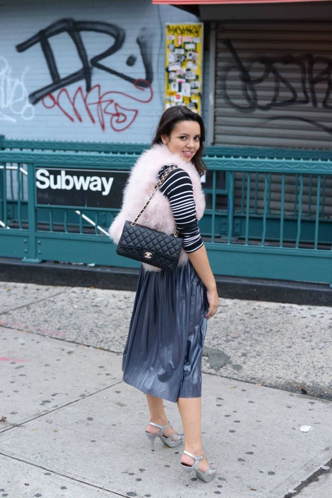 Feather vest & pleated midi skirt