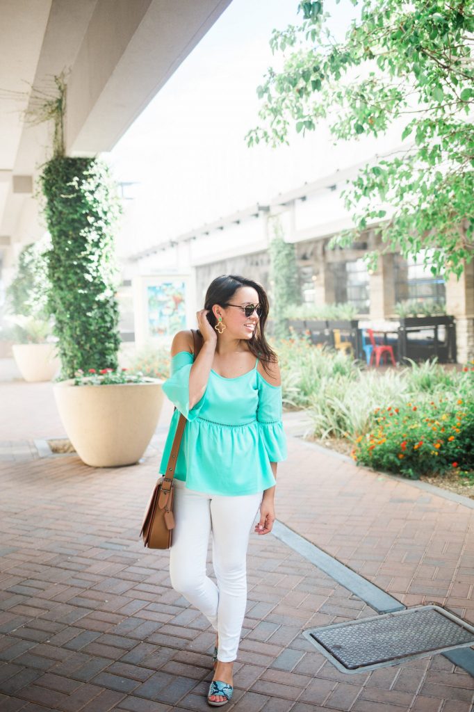 turquoise cold shoulder top and white denim