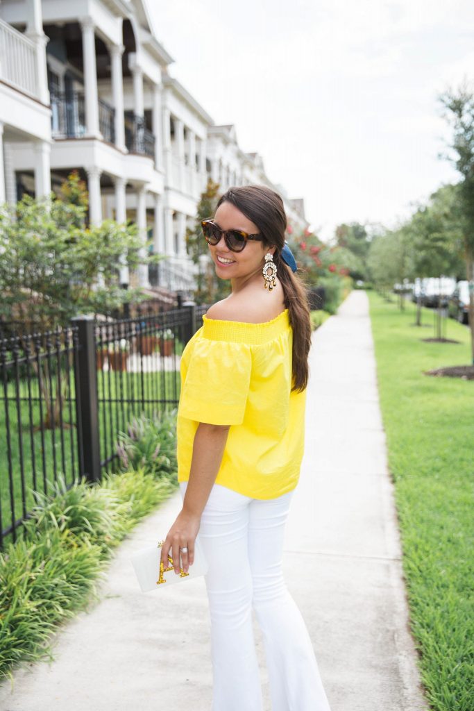 yellow off the shoulder top and white flares