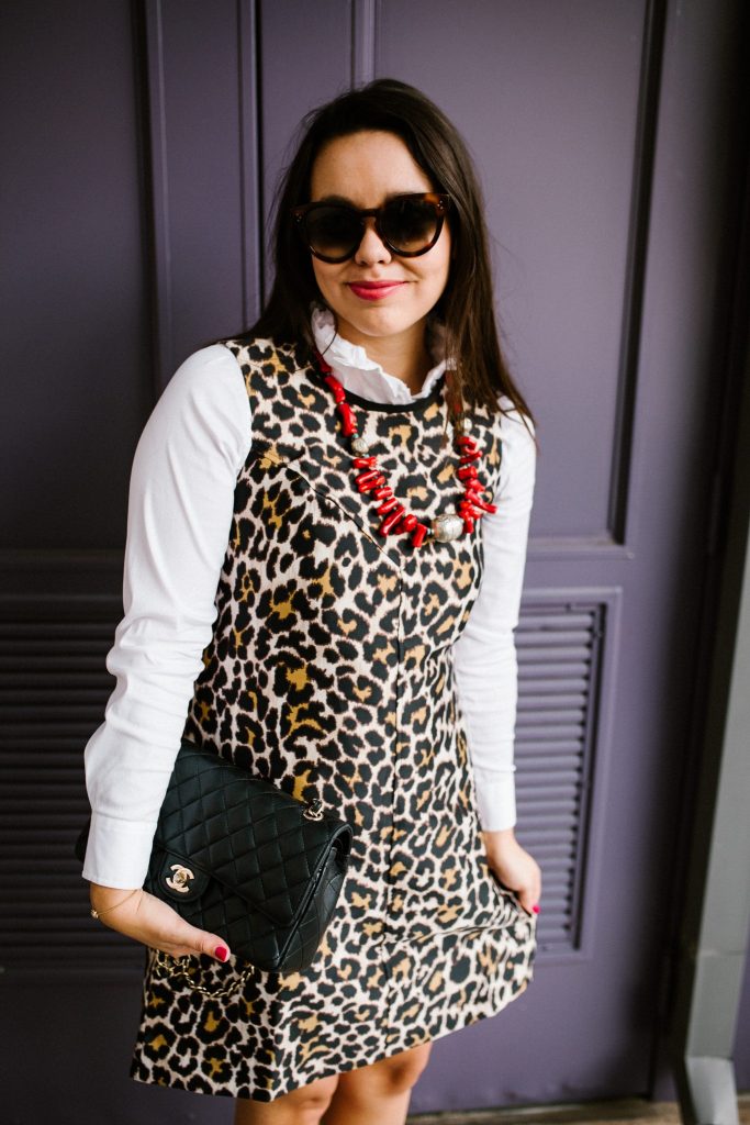 high-collared white button-down layered under dress