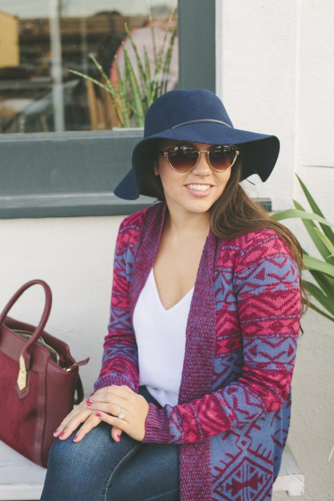 Navy floppy hat and burgundy purse