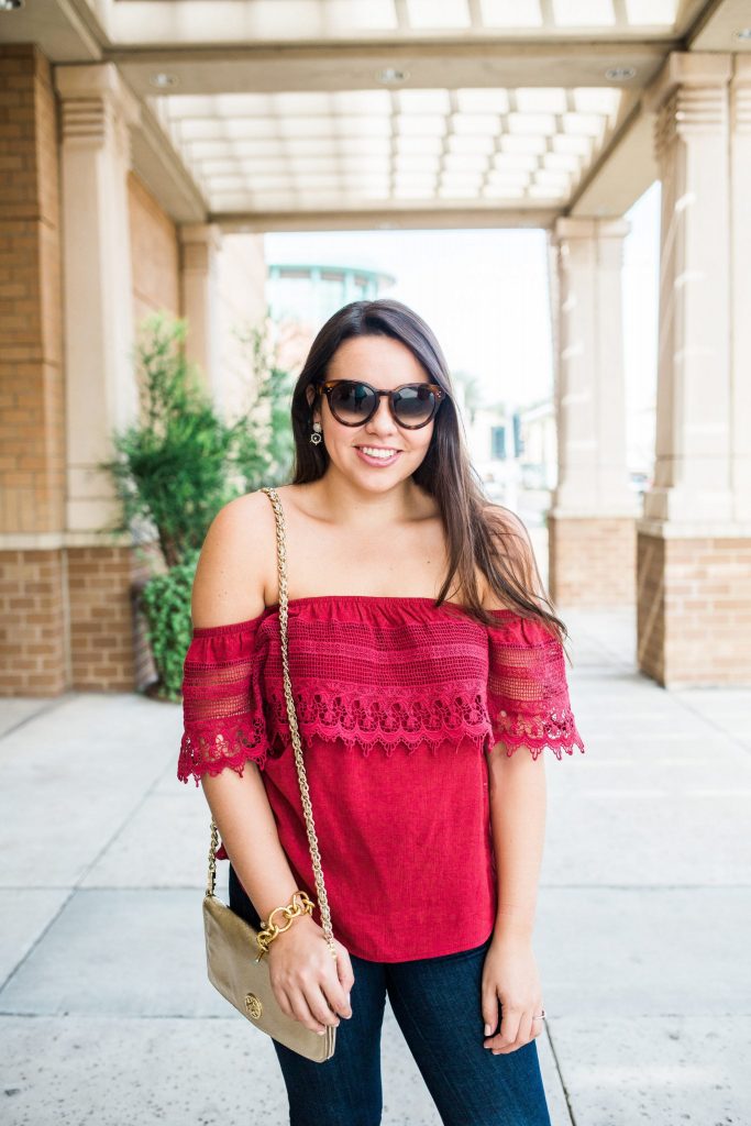 Red off the shoulder top and denim 