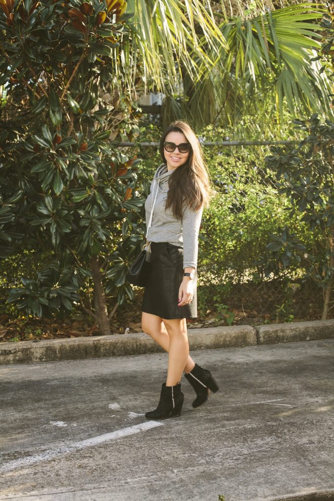 The coziest grey sweatshirt paired with a faux leather skirt for a casual yet dressed up look 