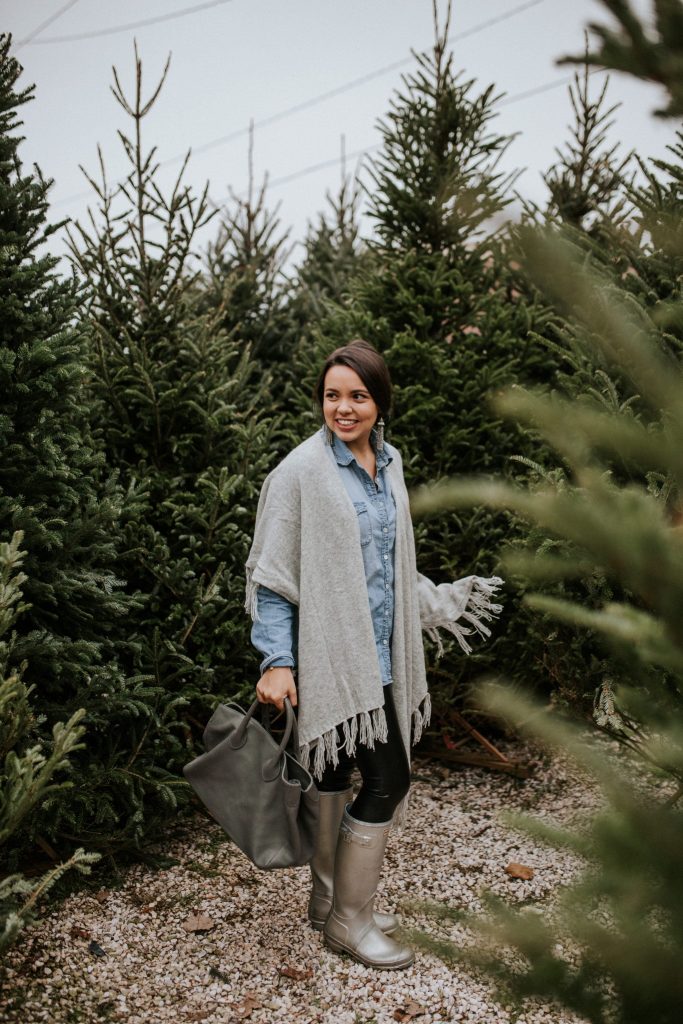 Fringed cape in heather grey, perfect for tossing on and moving on the go