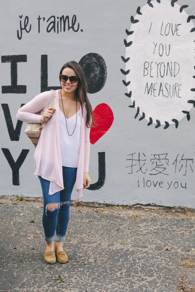 pale pink cashmere sweater and ripped jeans