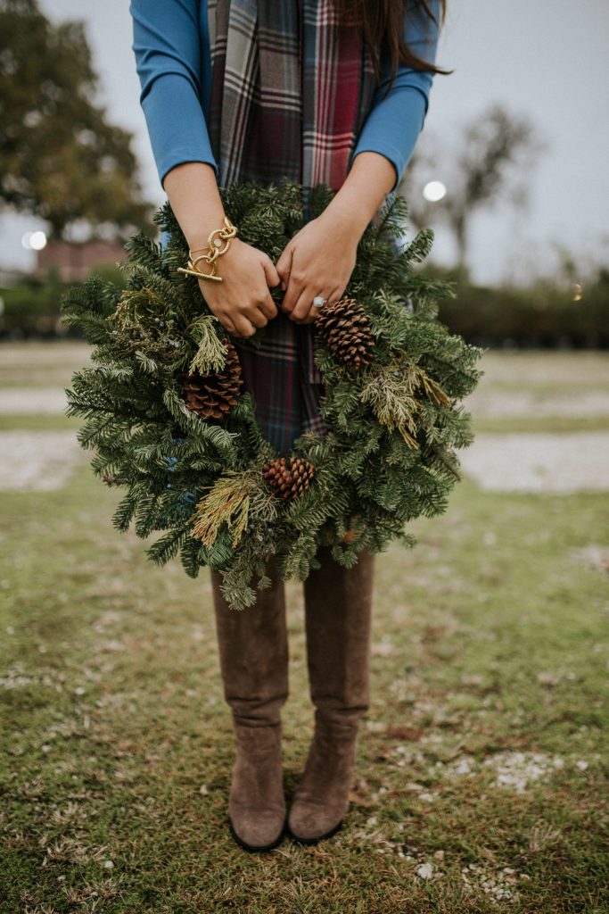 Holiday wreathes and knee-high suede boots