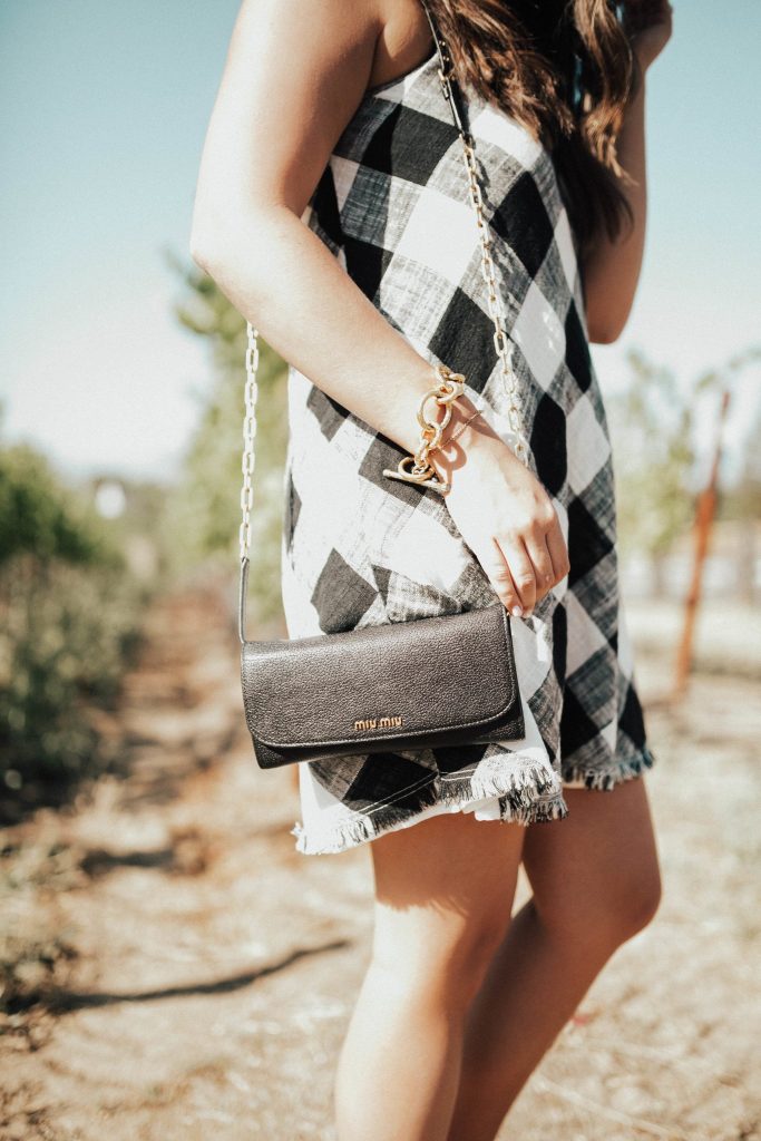 Anthropologie gingham dress, miu miu purse, gold bracelets