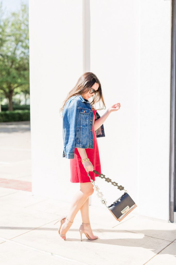 jean jacket thrown over a dress