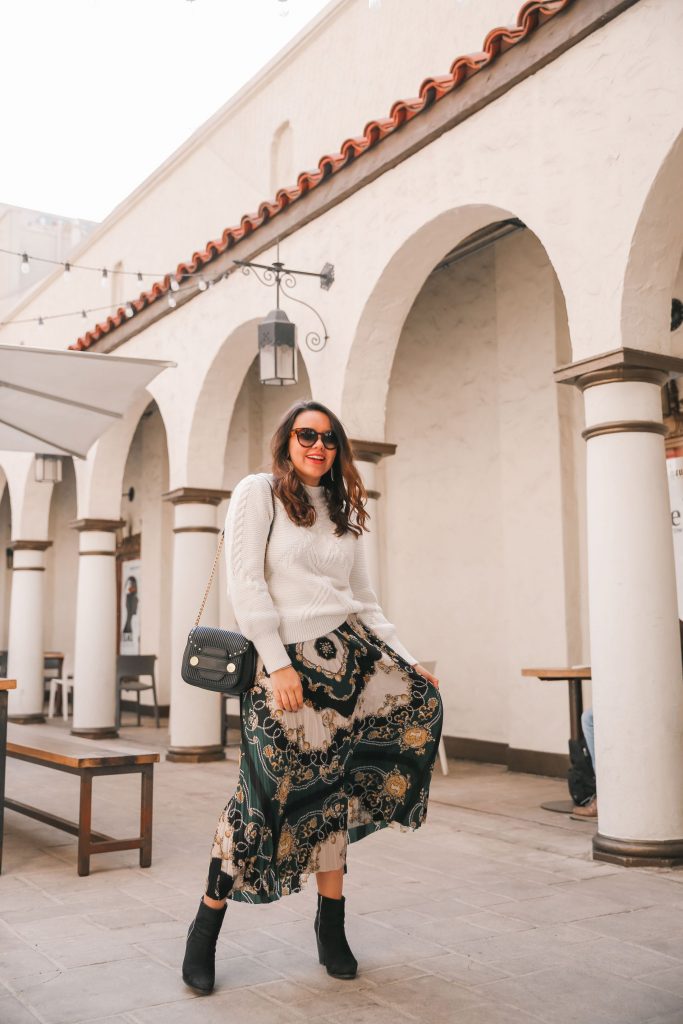 how to style a cable-knit sweater and pleated skirt for fall and winter