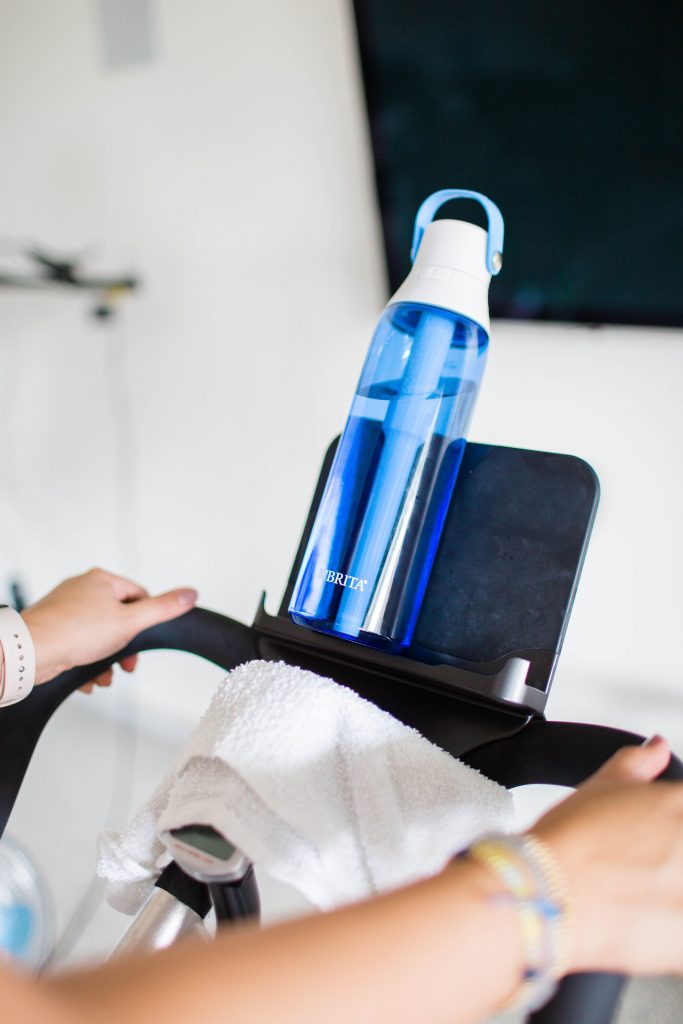 At home spin cycling routine with Britta water bottles