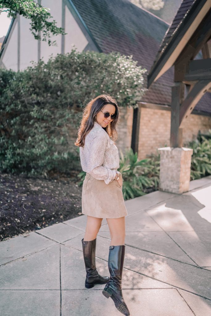 Chocolate brown riding boots and suede skirt pairing