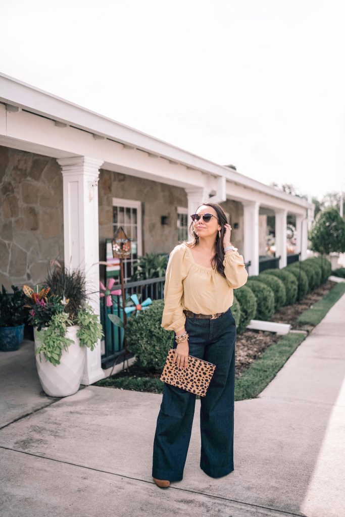 Louis Vuitton logo belt, wide-leg denim 