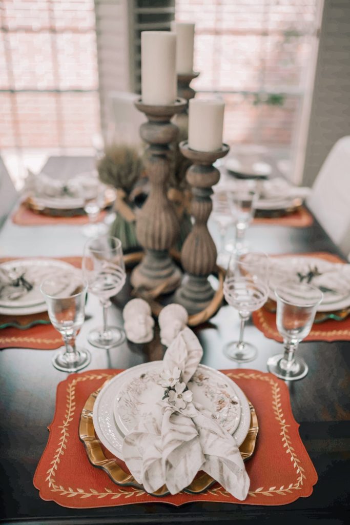 Carved wood candle holders as centerpieces 