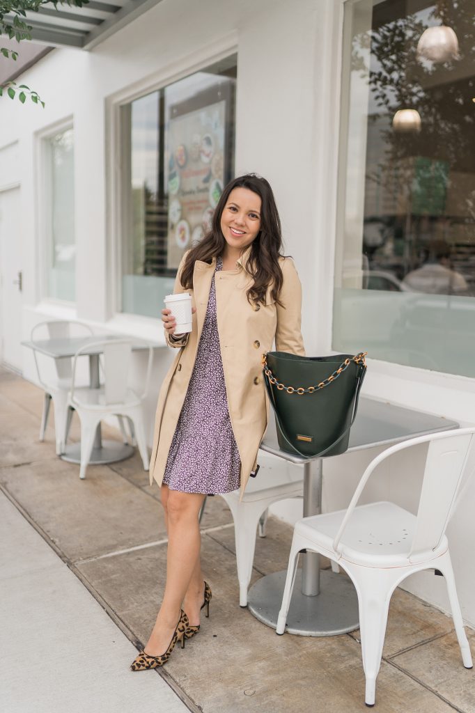 Styling a classic beige trench coat over a dress 
