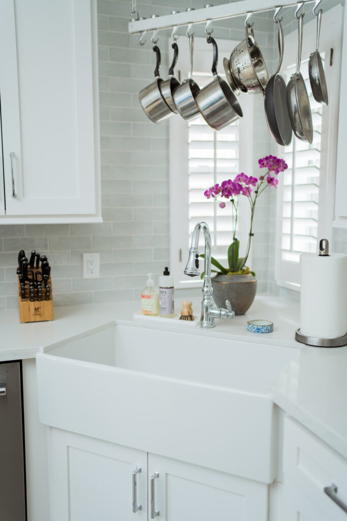 Farmhouse sink and polished chrome faucet in a classic kitchen remodel | Girl Wonder Life