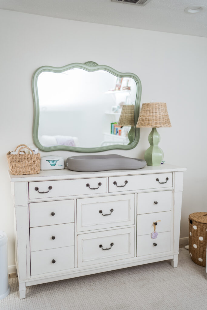 Gender neutral baby nursery decor and diaper changing station with rattan accents | Girl Wonder Life