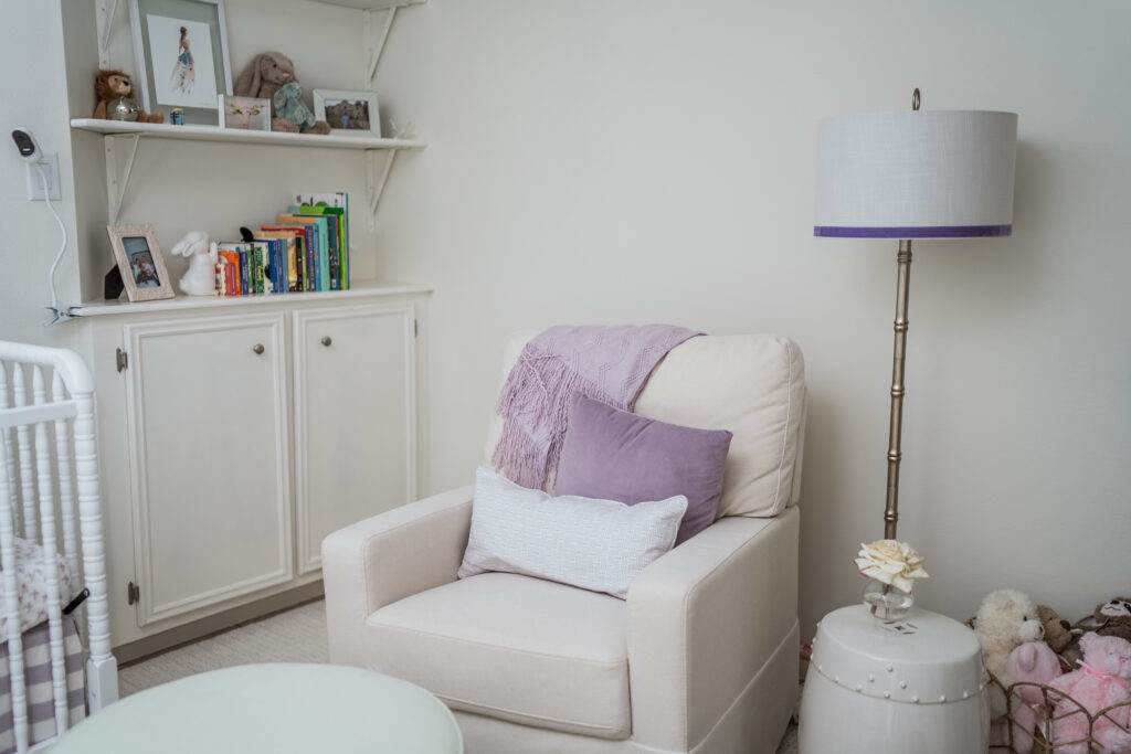 Million Dollar Baby Crawford swivel glider with Schumacher custom pillows for baby girl nursery | Girl Wonder Life