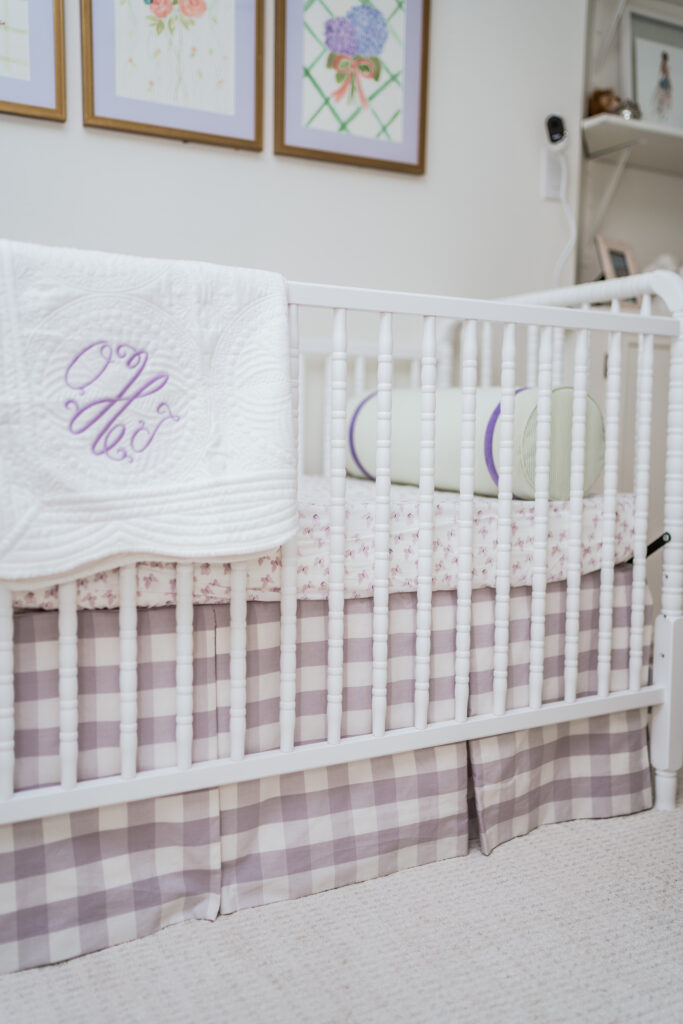 DaVinci Jenny Lind 3-in-1 white crib with Schumacher gingham lilac fabric crib skirt for baby girl nursery | Girl Wonder Life