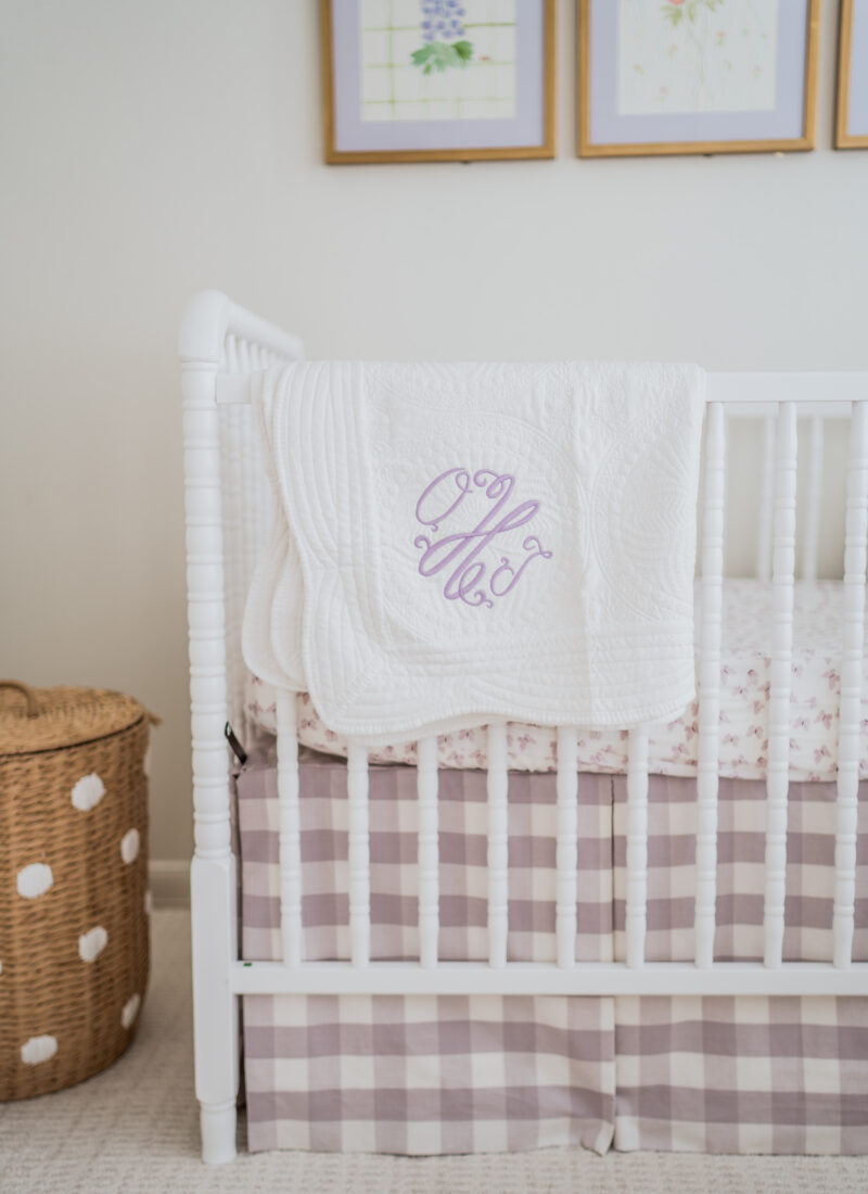 A serene baby girl nursery with pops of green & lavender